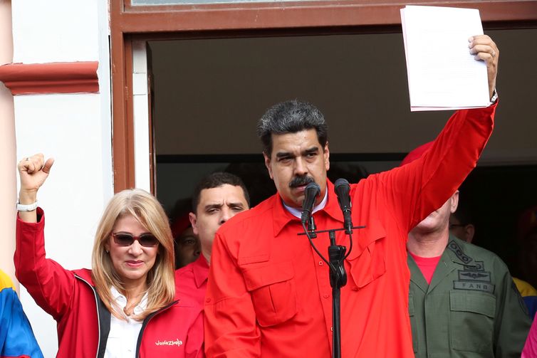 Venezuela's President Nicolas Maduro attends a rally in support of his government and to commemorate the 61st anniversary of the end of the dictatorship of Marcos Perez Jimenez next to his wife Cilia Flores in Caracas, Venezuela January 23, 2019