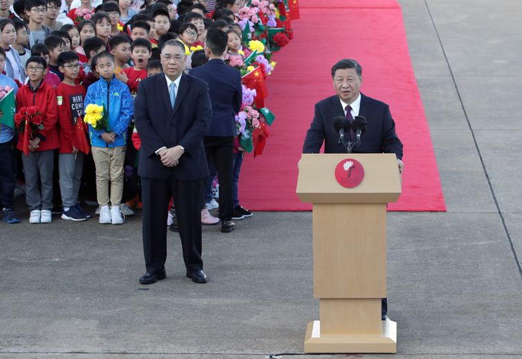 Chinese President Xi Jinping speaks next to outgoing Macau Chief Executive Fernando Chui, upon his arrival at Macau International Airport in Macau, China December 18, 2019, ahead of the 20th anniversary of the former Portuguese colony&#039;s return