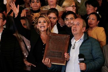 REUTERS/Carlos Garcia Rawlins Bolivian Senator Jeanine Anez gestures as she poses for a picture after she declared herself as Interim President of Bolivia, at the Presidential Palace, in La Paz, Bolivia November 12, 2019. REUTERS/Carlos Garcia Rawlins