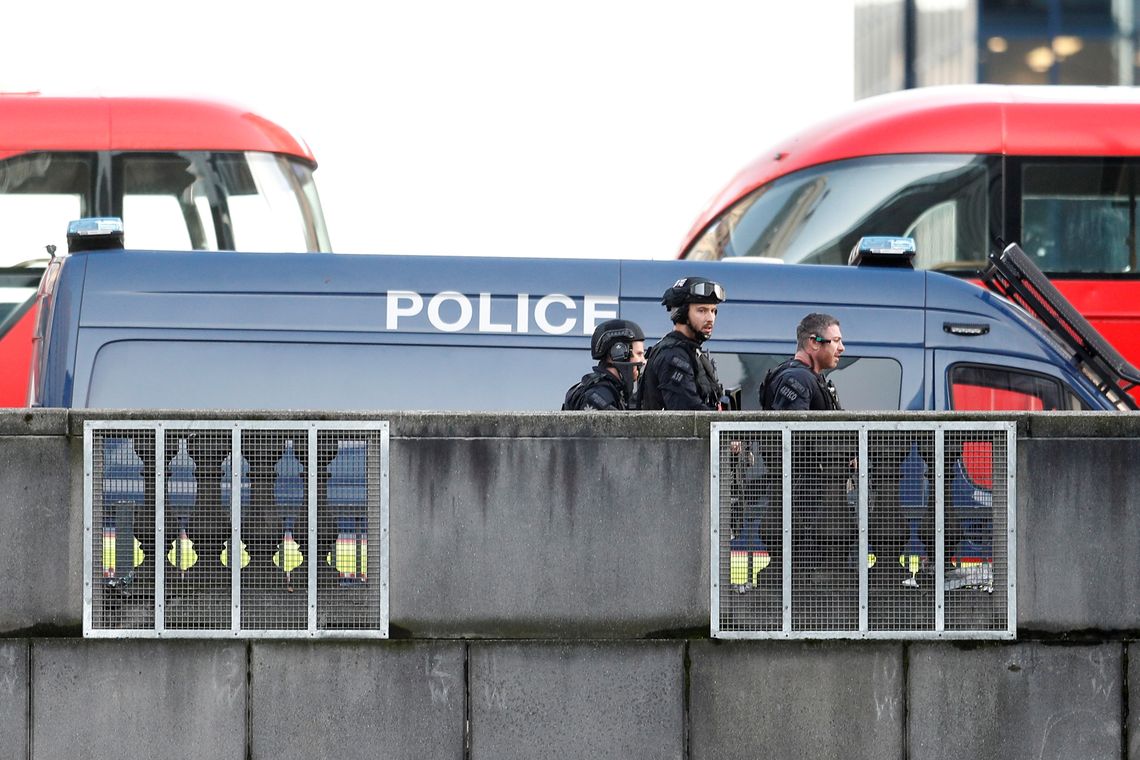 Police officers and emergency staff work at the site of an incident at London Bridge in London, Britain, November 29, 2019. REUTERS/Peter Nicholls