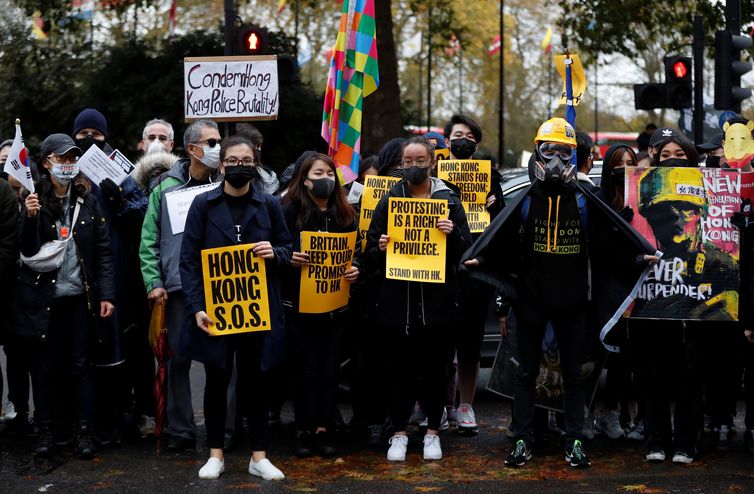 Demonstrators hold placards during a &quot;Stand with Hong Kong&quot; rally in London, Britain, November 2, 2019. REUTERS/Yara Nardi