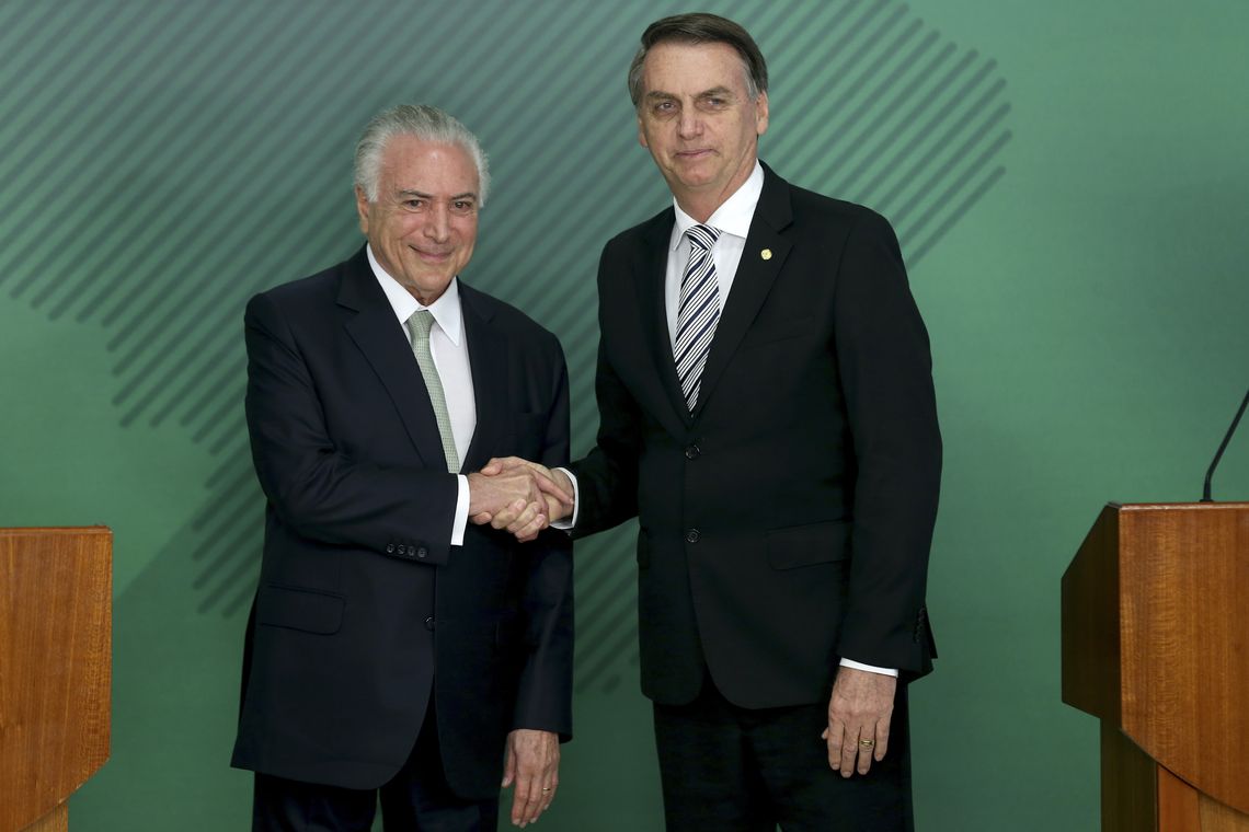 O presidente Michel Temer e o presidente eleito Jair Bolsonaro durante pronunciamento no Palácio do Planalto.