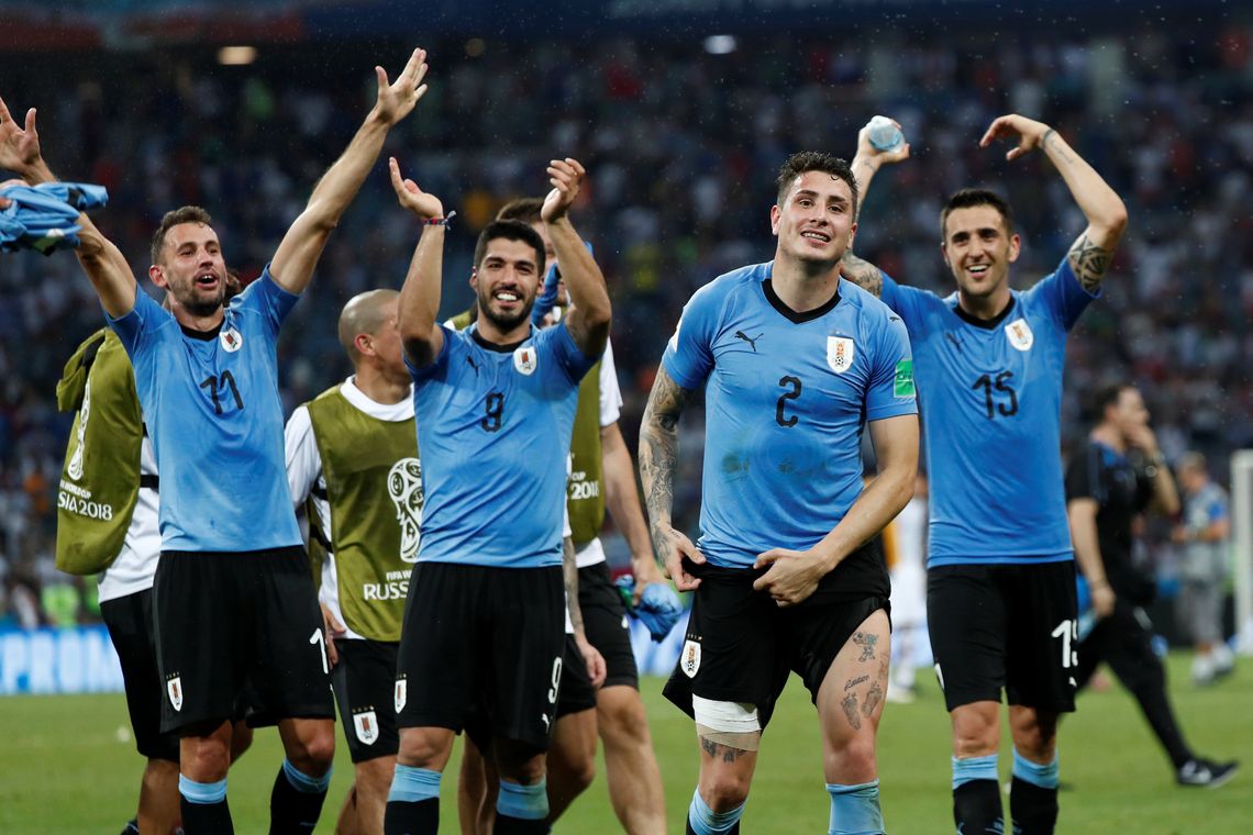 Soccer Football - World Cup - Round of 16 - Uruguay vs Portugal - Fisht Stadium, Sochi, Russia - June 30, 2018 Uruguay's Luis Suarez, Jose Gimenez and team mates celebrate after the match REUTERS/Murad Sezer