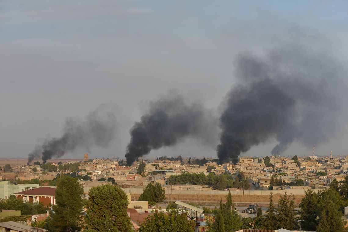 Smoke rises from the Syrian border town of Ras al-Ain as it is pictured from the Turkish town of Ceylanpinar in Sanliurfa province, Turkey, October 9, 2019. REUTERS/Stringer NO RESALES. NO ARCHIVES TUROUT