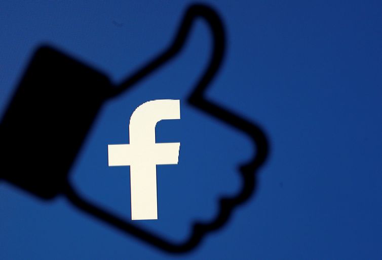 FILE PHOTO: A 3D-printed Facebook like button is seen in front of the Facebook logo, in this illustration taken October 25, 2017. REUTERS/Dado Ruvic/Illustration/File Photo