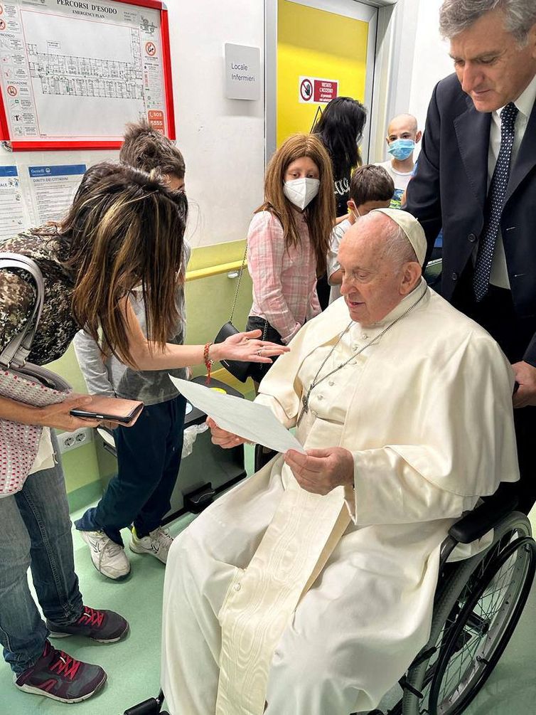 Pope Francis speaks to a person as he visits the children at the paediatric oncology department of Gemelli hospital, in Rome, Italy June 15, 2023. Vatican Media/?Handout via REUTERS    ATTENTION EDITORS - THIS IMAGE WAS PROVIDED BY A THIRD PARTY.