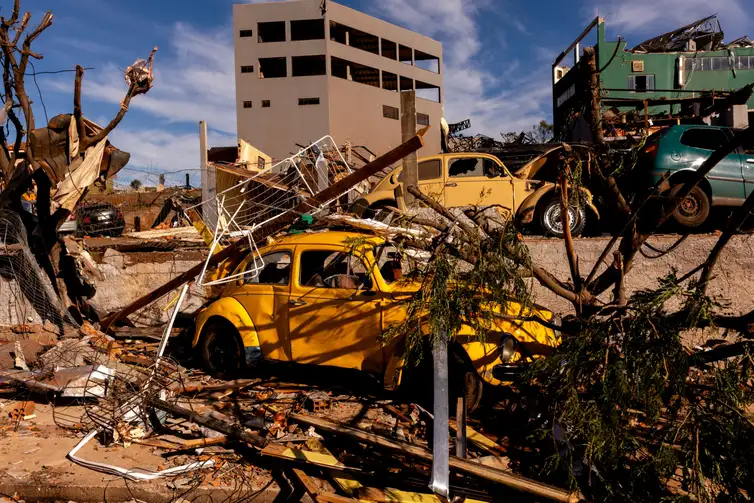 Debris lies on a vehicle at a damaged area after the tornado that hit Rio Bonito do Iguacu, in southern Parana state, Brazil November 9, 2025. REUTERS/Priscila Ribeiro
