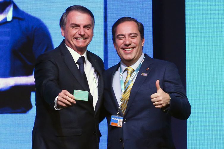 Os presidentes da Caixa Ecônomica Federal, Pedro Guimarães e da república ,  Jair Bolsonaro,  participam da abertura da reunião de gestores Nação Caixa