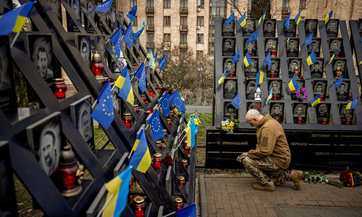 A soldier pays his respects at the monument to the so-called 