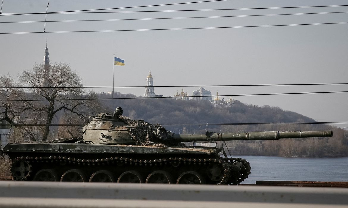 A train carries captured Russian tanks in Kyiv