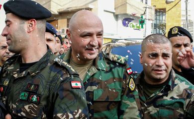 FILE PHOTO: Rice is thrown on Newly-appointed General Joseph Aoun (C) as army commander, upon his arrival at his family's house in Sin El Fil, northeast of Beirut, Lebanon March 8, 2017. REUTERS/Mohamed Azakir//File Photo