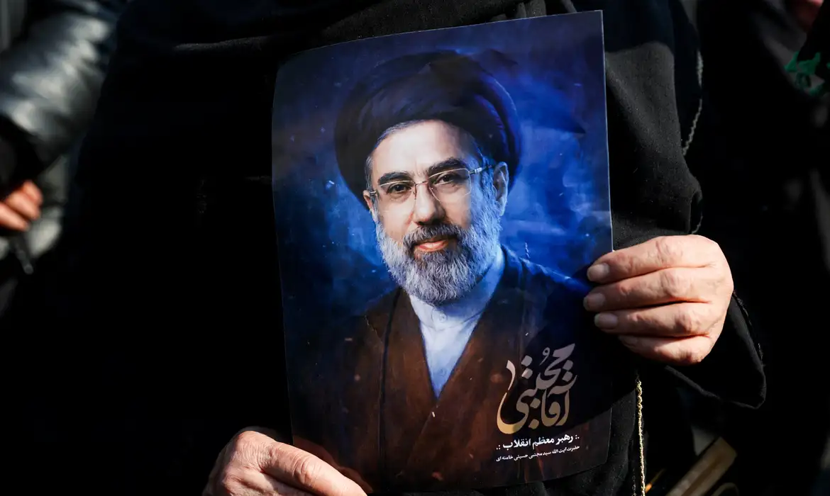 A woman holds a portrait of Iran's new supreme leader Mojtaba Khamenei, on the day of a gathering to support Mojtaba Khamenei, amid the U.S.-Israeli conflict with Iran, in Tehran, Iran, March 9, 2026. Majid Asgaripour/WANA (West Asia News Agency) via REUTERS ATTENTION EDITORS - THIS PICTURE WAS PROVIDED BY A THIRD PARTY