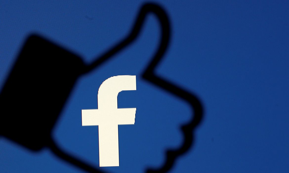 FILE PHOTO: A 3D-printed Facebook like button is seen in front of the Facebook logo, in this illustration taken October 25, 2017. REUTERS/Dado Ruvic/Illustration/File Photo