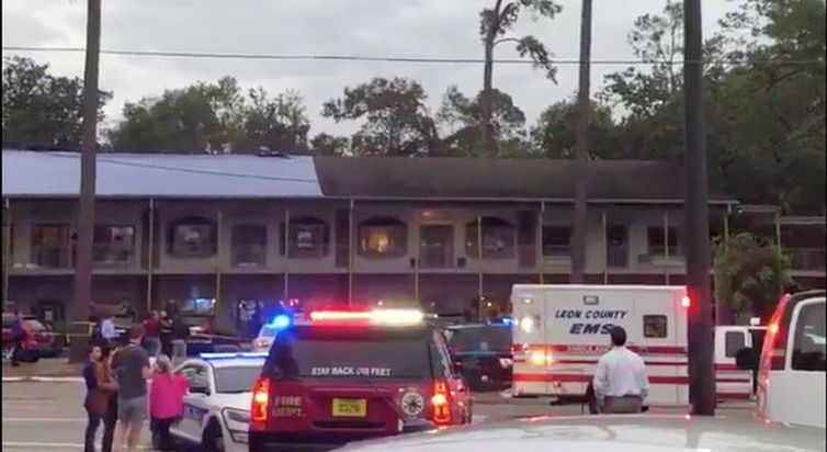 Emergency vehicles are parked outside the Hot Yoga studio at a shopping center where a guman opened fire in Tallahasee, Florida, U.S., November 2, 2018, in this still image taken from a video obtained from social media. Erin Vansickle/via
