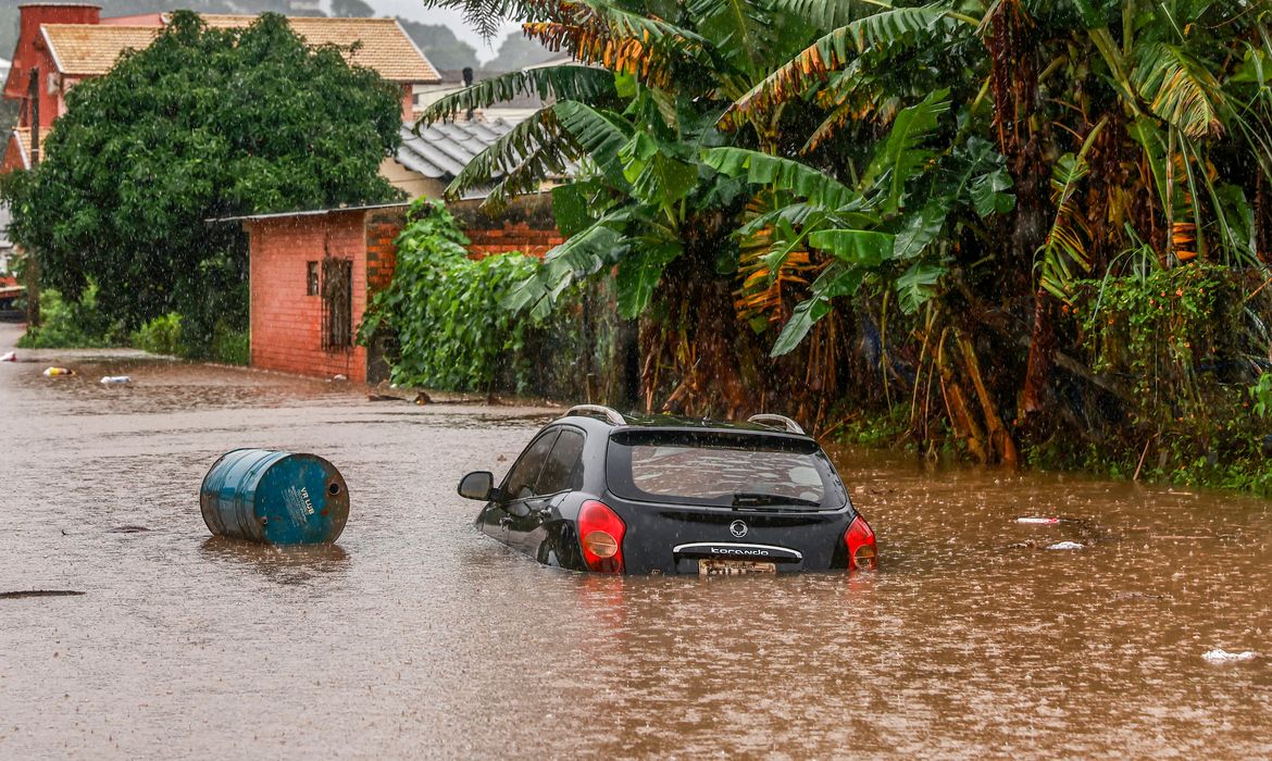 A car stands in the flooded road near the Taquari River, during heavy rains in the city of Encantado in Rio Grande do Sul, Brazil, May 1, 2024. REUTERS/Diego Vara