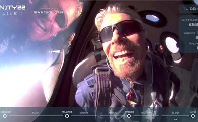 Billionaire Richard Branson reacts on board Virgin Galactic's passenger rocket plane VSS Unity after reaching the edge of space above Spaceport America