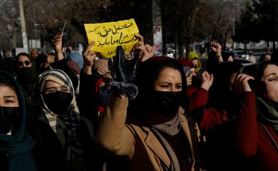 Afghan women chant slogans in protest against the closure of universities to women by the Taliban in Kabul