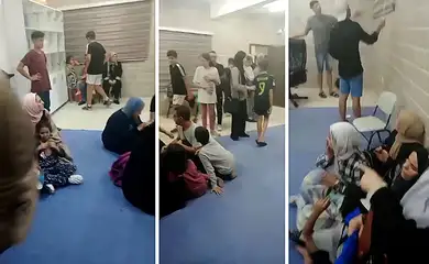 13/10/2023, A brasileira Shahed Albanna, de 18 anos, que está no local, enviou um áudio a nossa reportagem onde é possível ouvir o som de bomba caindo próximo à escola. Em seguida, Shahed enviou vídeo onde mostra pessoas abrigadas na escola em um único cômodo, como forma de se proteger de possíveis bombas. Foto: Frame/Shaed Albanna