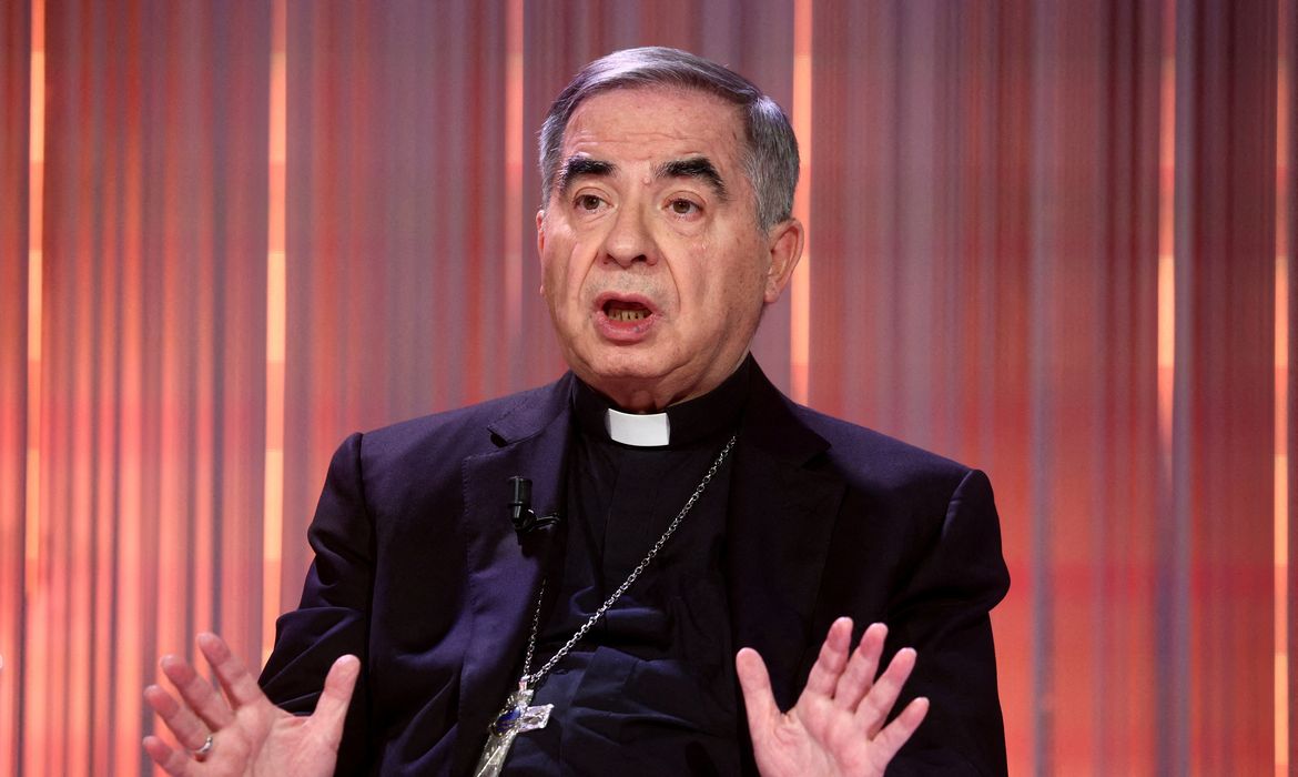 FILE PHOTO: Cardinal Angelo Becciu, who was convicted of embezzlement and fraud and sentenced to five-and-a-half years in jail, gestures during the taping of the television talk show 