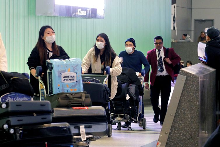 FILE PHOTO: Passengers arrive at LAX from Shanghai, China