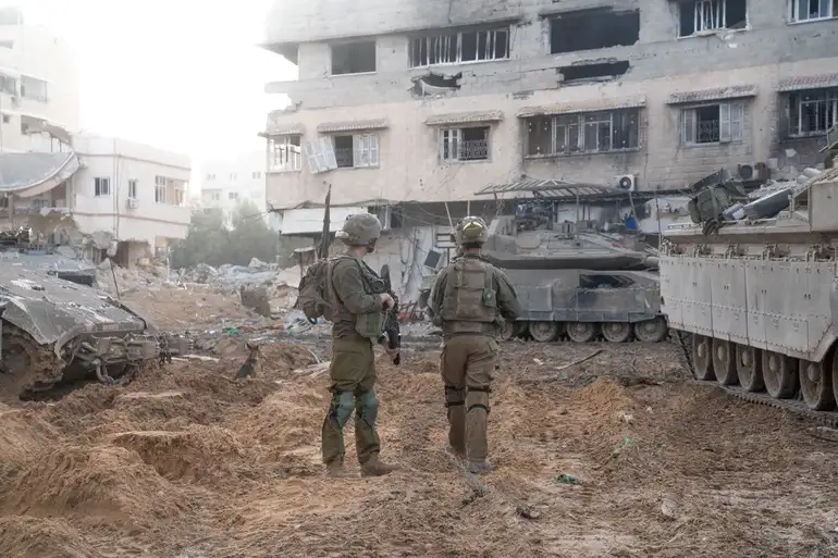Israeli soldiers operate in the Gaza Strip during a temporary truce between Israel and the Palestinian Islamist group Hamas, in this handout picture released on November 28, 2023. Israel Defense Forces/Handout via REUTERS    THIS IMAGE HAS BEEN SUPPLIED BY A THIRD PARTY