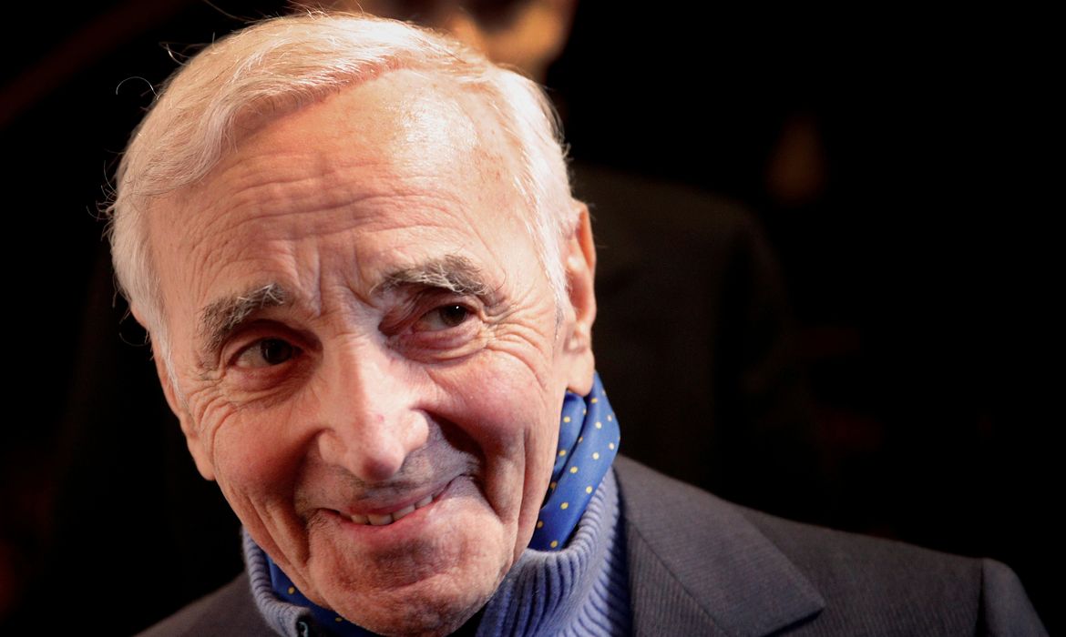 FILE PHOTO: French singer Charles Aznavour attends the annual dinner of CCAF (Co-ordination Council of Armenian organisations of France), in Paris, France, February 8, 2017. Picture taken February 8, 2017.  REUTERS/Christophe Ena/Pool/File Photo