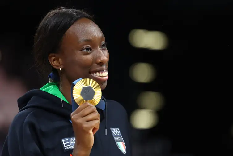 Paris 2024 Olympics - Volleyball - Women's Victory Ceremony - South Paris Arena 1, Paris, France - August 11, 2024. Gold medallist Paola Ogechi Egonu of Italy celebrates on the podium. REUTERS/Siphiwe Sibeko