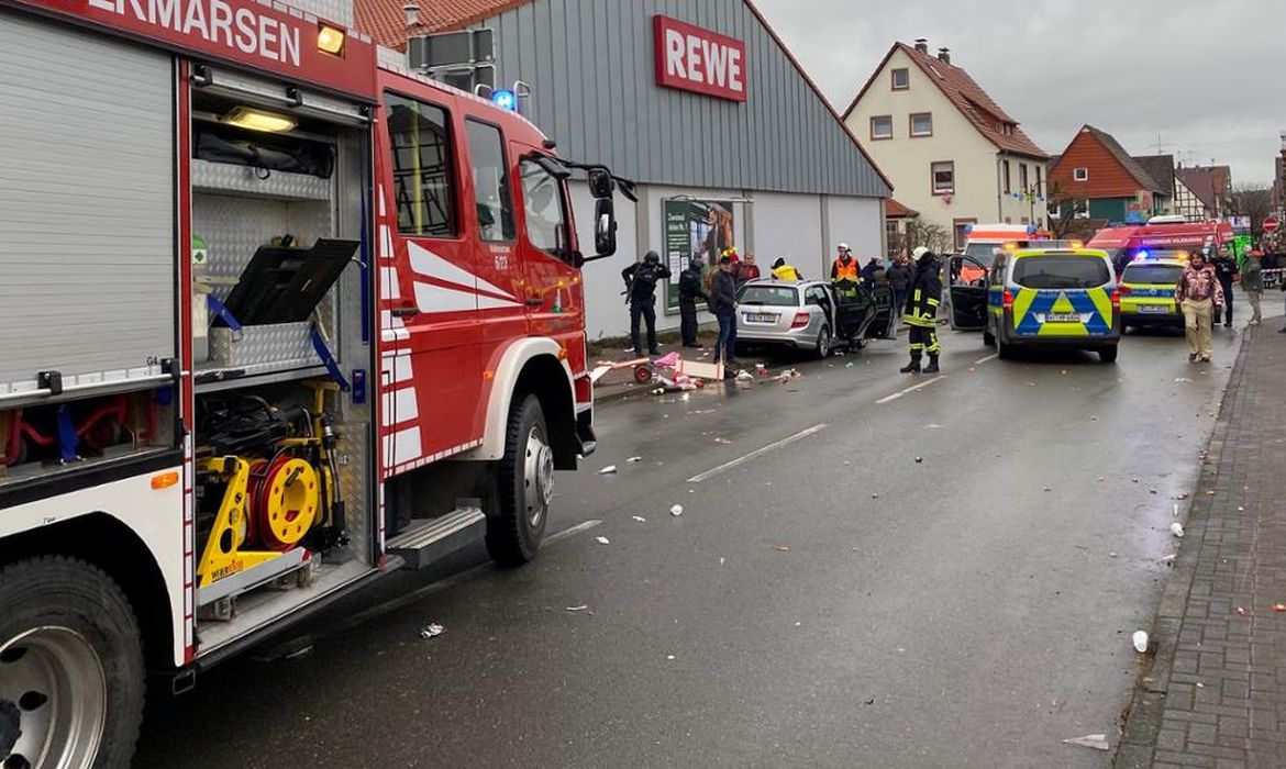 People react at the scene after a car ploughed into a carnival parade injuring several people in Volkmarsen