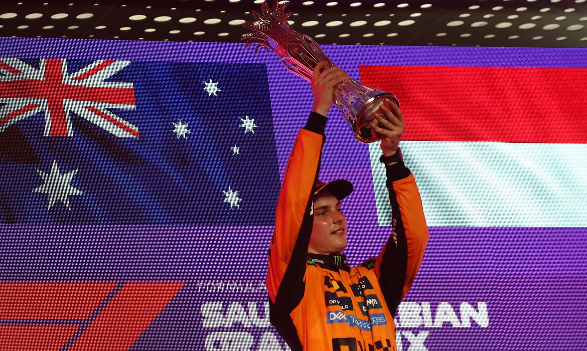 Formula One F1 - Saudi Arabian Grand Prix - Jeddah Corniche Circuit, Jeddah, Saudi Arabia - April 20, 2025
McLaren's Oscar Piastri celebrates with the trophy on the podium after winning the Saudi Arabian Grand Prix REUTERS/Jakub Porzycki