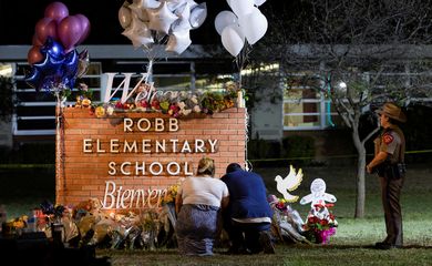 People react after a mass shooting at Robb Elementary School in Uvalde