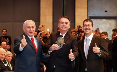 O presidente da República, Jair Bolsonaro, acompanhado do primeiro-ministro de Israel, Benjamin Netanyahu, participa da cerimônia de abertura do encontro empresarial Brasil-Israel, em Jerusalém.