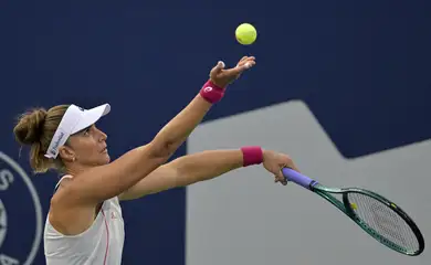 Jul 29, 2025; Montreal, QC, Canada; Beatriz Haddad Maia (BRA) serves against Suzan Lamens (NED) in second round play at IGA Stadium. Mandatory Credit: Eric Bolte-Imagn Images