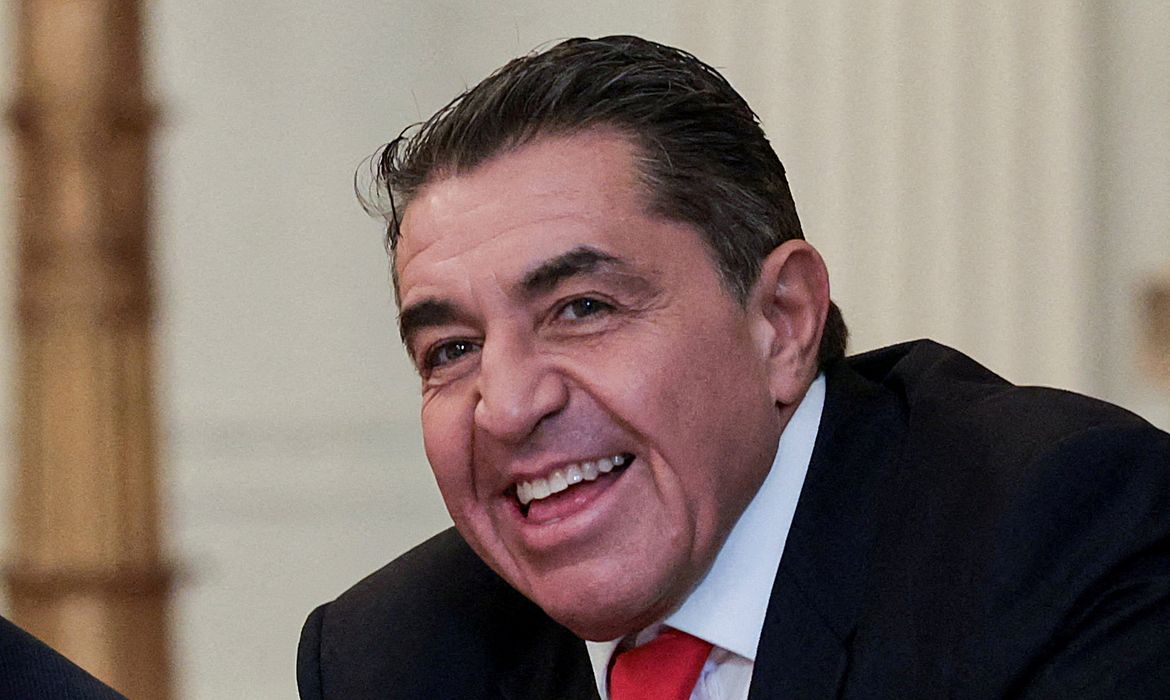 FILE PHOTO: Anthony Lomangino, a sanitation and recycling businessman and a Trump nominee to the U.S. Postal Service Board of Governors, and Paolo Zampolli, a friend of President Donald Trump and Trump’s envoy for global partnerships, attend a lunch with the Kennedy Center board members in the East Room of the White House in Washington, D.C., U.S., March 16, 2026. REUTERS/Jonathan Ernst/File Photo
