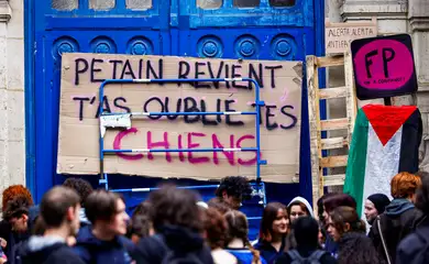 French high school students block the access to the Lycee Voltaire highschool in Paris to protest against the rise of far-right parties, after French far-right win in European Parliament vote and ahead of early legislative elections in France, June 11, 2024. The placard reads 