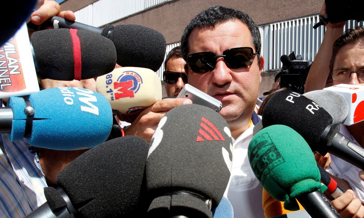 FILE PHOTO: Soccer agent Mino Raiola speaks to the media as he arrives at FC Barcelona's office in Barcelona