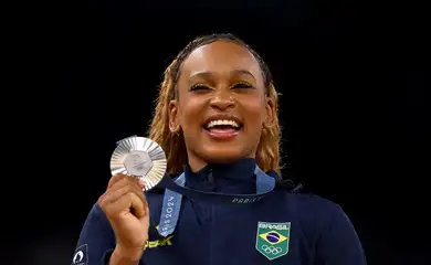 Paris 2024 Olympics - Artistic Gymnastics - Women's All-Around Victory Ceremony - Bercy Arena, Paris, France - August 01, 2024.
Silver medallist Rebeca Andrade of Brazil celebrates on the podium. REUTERS/Hannah Mckay