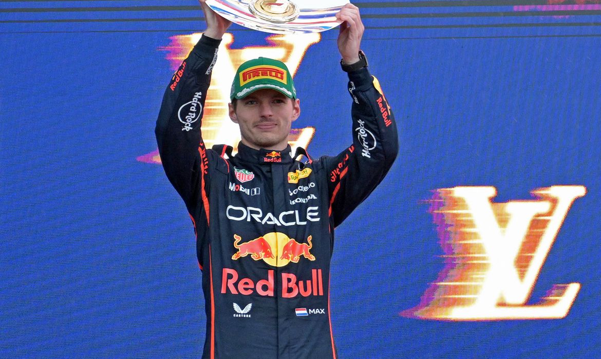 Formula One F1 - Australian Grand Prix - Albert Park Grand Prix Circuit, Melbourne, Australia - March 16, 2025 Red Bull's Max Verstappen celebrates with his trophy on the podium after finishing second in the Australian Grand Prix REUTERS/Tracey Nearmy