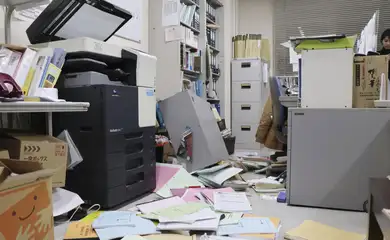 Bookshelves and documents that fell during an earthquake are seen at Kyodo News' Hakodate bureau in Hakodate, Hokkaido, Japan, December 8, 2025 in this photo taken by Kyodo. Mandatory credit Kyodo/via REUTERS ATTENTION EDITORS - THIS IMAGE HAS BEEN SUPPLIED BY A THIRD PARTY. MANDATORY CREDIT. JAPAN OUT. NO COMMERCIAL OR EDITORIAL SALES IN JAPAN.