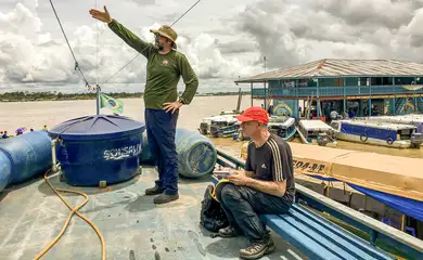 Bruno Periera indicating, to Journalist Dom Phillips, the direction of travel down the Rio Itaquai prior to the the start of a 5 week expedition into the Vale Do Javari in 2018. The Funai expedition was to track and evidence the movements of uncontacted Indigenous indians within the Javari Valley. The Javari has the largest concentration of uncontacted indigenous population in the World. Leticia, Amazon.