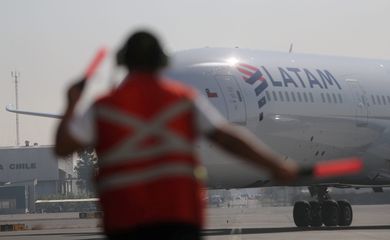 FILE PHOTO: A passenger plane arrives at the Arturo Merino Benitez International Airport in Santiago