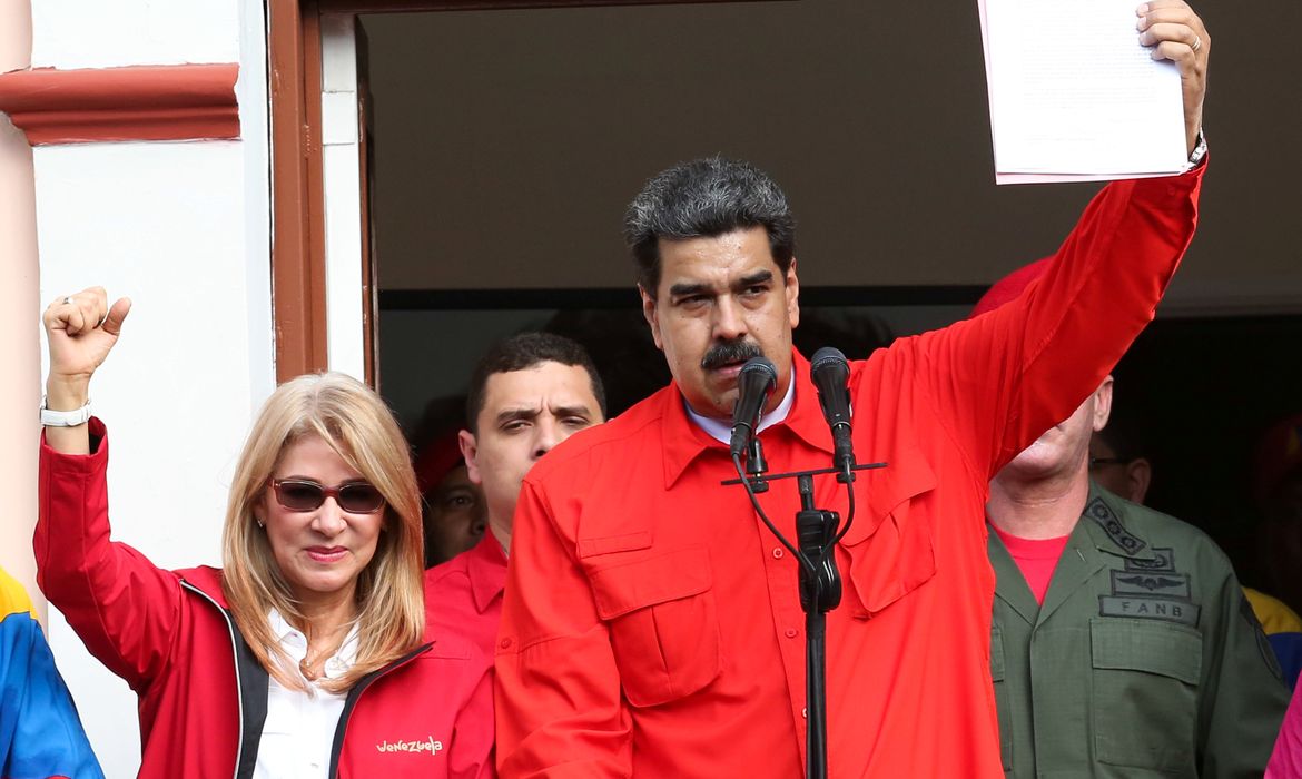 Venezuela's President Nicolas Maduro attends a rally in support of his government and to commemorate the 61st anniversary of the end of the dictatorship of Marcos Perez Jimenez next to his wife Cilia Flores in Caracas, Venezuela January 23, 2019