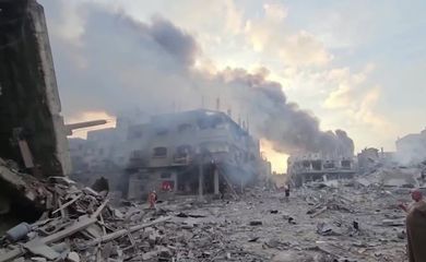 Smoke billows over flattened buildings in Gaza's Jabalia camp