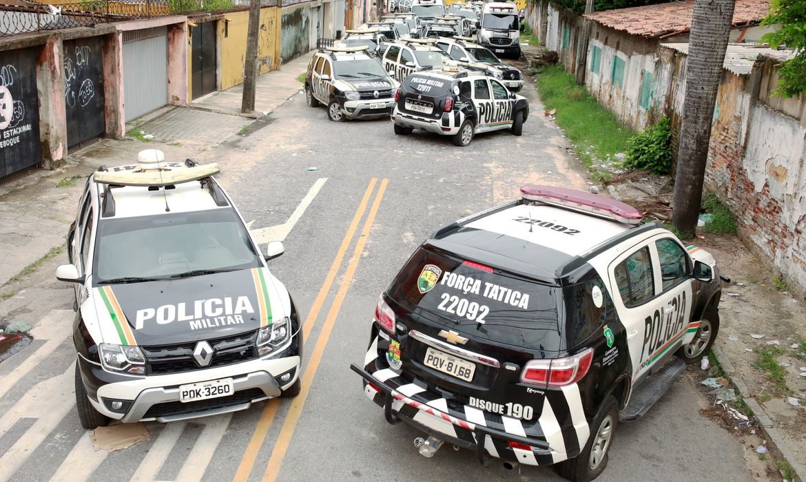 Military police vehicles are seen in front of their battalion during a police strike in Fortaleza