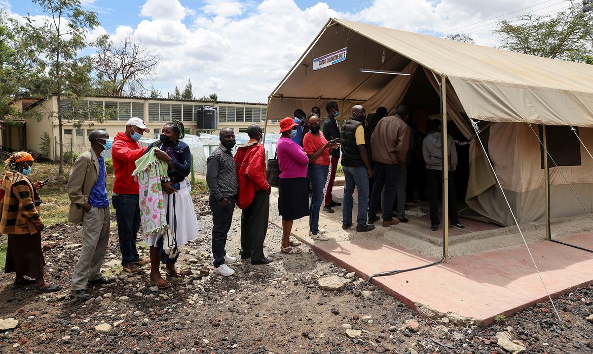 People stand in line to receive COVID-19 vaccine, in Narok
