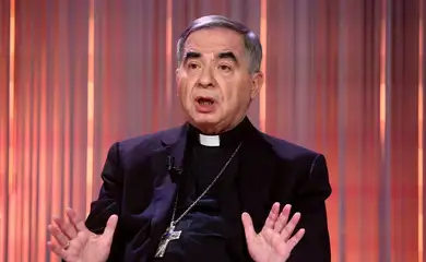FILE PHOTO: Cardinal Angelo Becciu, who was convicted of embezzlement and fraud and sentenced to five-and-a-half years in jail, gestures during the taping of the television talk show 