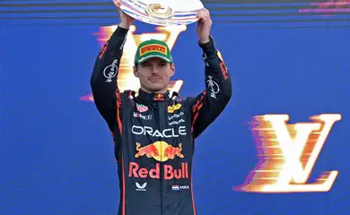 Formula One F1 - Australian Grand Prix - Albert Park Grand Prix Circuit, Melbourne, Australia - March 16, 2025 Red Bull's Max Verstappen celebrates with his trophy on the podium after finishing second in the Australian Grand Prix REUTERS/Tracey Nearmy