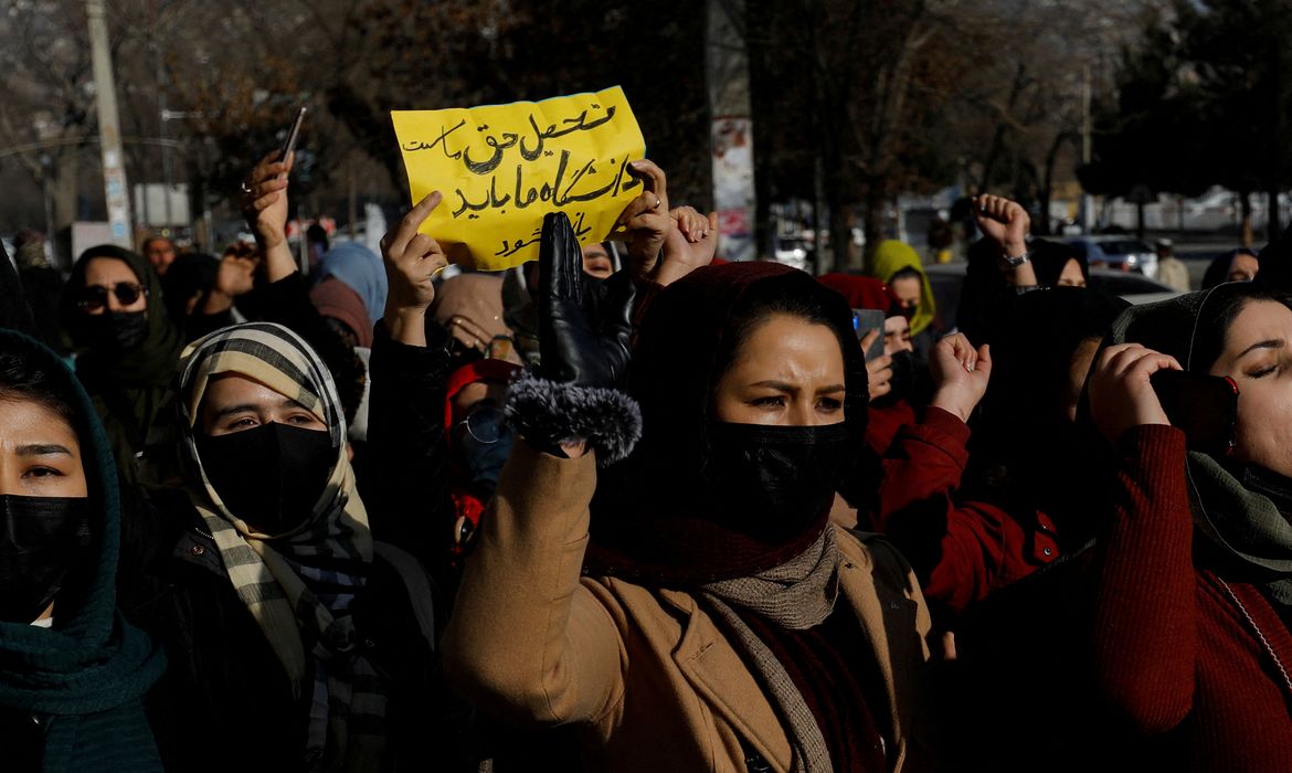Afghan women chant slogans in protest against the closure of universities to women by the Taliban in Kabul