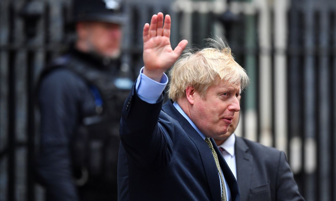 Britain's Prime Minister Boris Johnson waves as he leaves Downing Street on his way to Buckingham Palace after the general election in London, Britain, December 13, 2019. REUTERS/Dylan Martinez