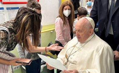 Pope Francis speaks to a person as he visits the children at the paediatric oncology department of Gemelli hospital, in Rome, Italy June 15, 2023. REUTERS/Vatican Media
