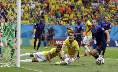 Brazil's David Luiz, centre, reacts after missing a chance during the World Cup third-place soccer match between Brazil and the Netherlands at the Estadio Nacional in Brasilia, Brazil, Saturday, July 12, 2014. (AP Photo